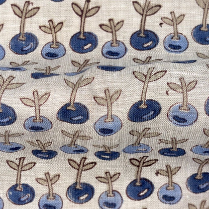 Pattern of blueberries with stems on a fabric background