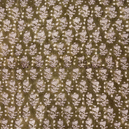 Patterned fabric with small floral design on a brown background