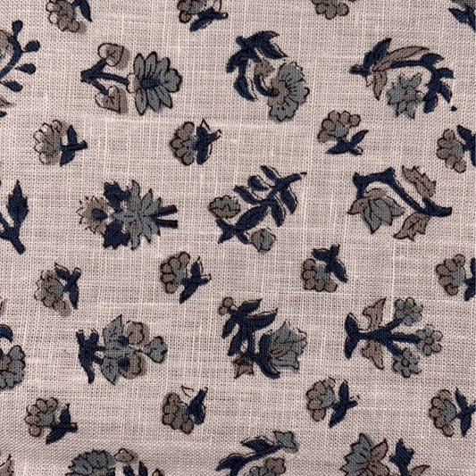 Floral patterned fabric with dark blue and brown flowers on a grey background