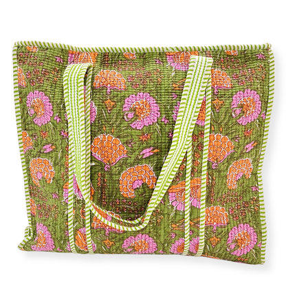 Green floral-patterned tote bag with white handle on a white background