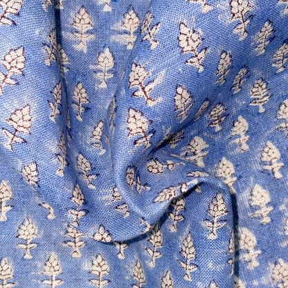 Close-up of blue fabric with white floral pattern