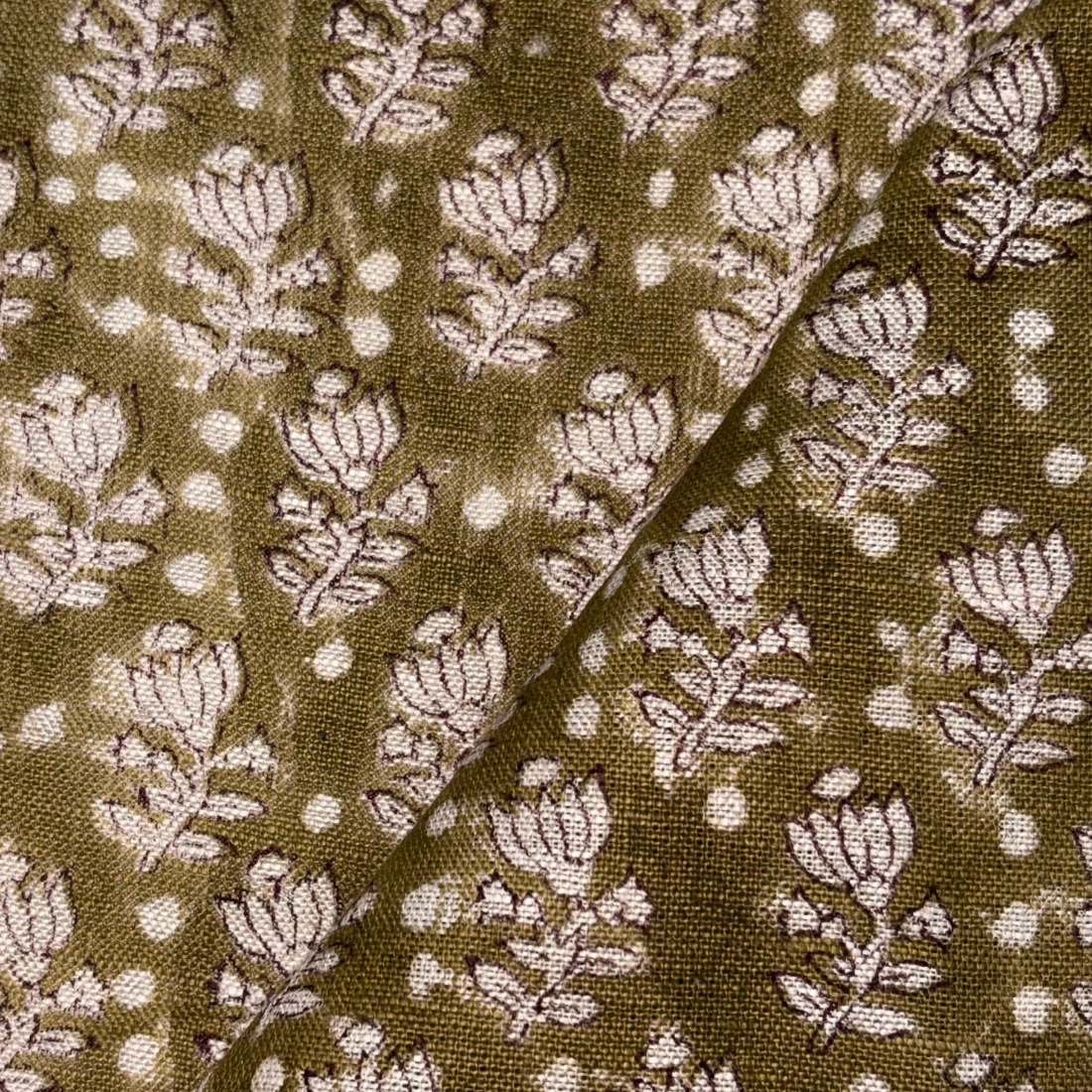 Fabric with floral pattern on a brown background