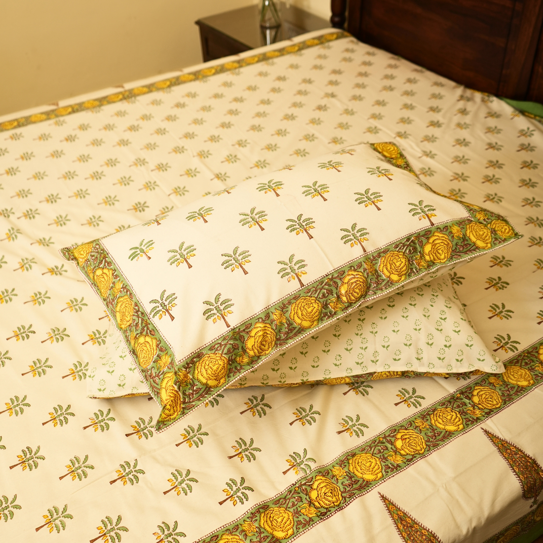 Decorative pillows with floral patterns on a matching fabric background