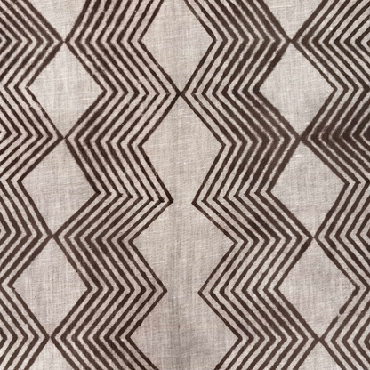 Textile with brown zigzag pattern on a grey background
