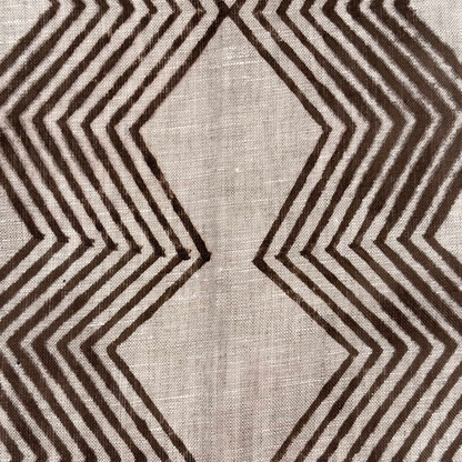 Textile with brown zigzag pattern on a neutral background