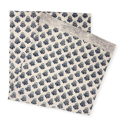 Navy floral patterned table runner on a white background
