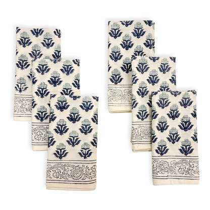 Set of six decorative napkins with blue floral patterns on a white background