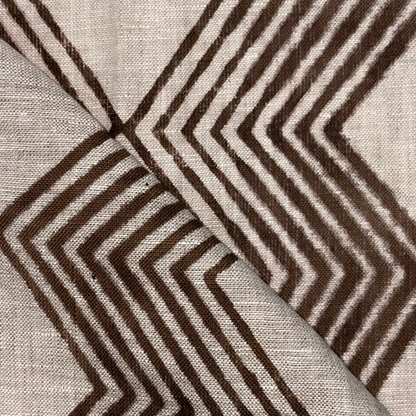 Close-up of fabric with brown zigzag pattern on grey background