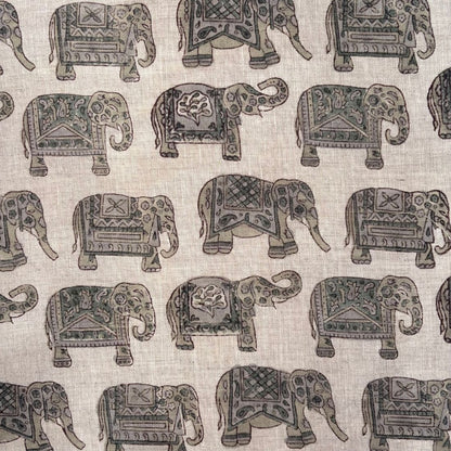 Pattern of decorative elephants on a grey fabric background