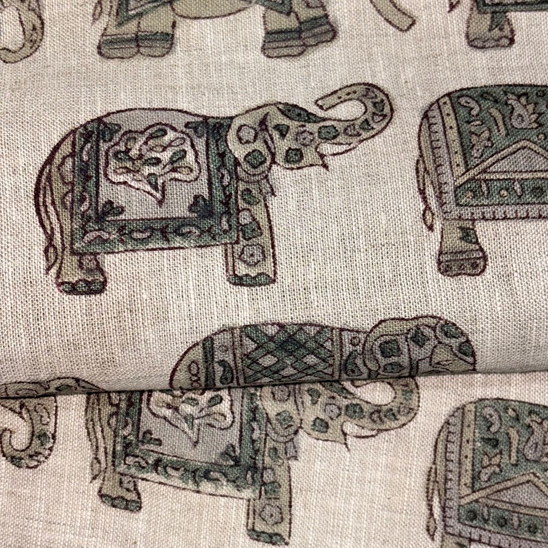 Pattern of decorated elephants on a fabric background