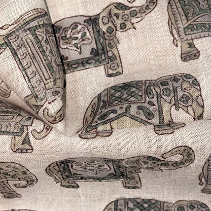 Patterned fabric with elephant designs on a grey  background