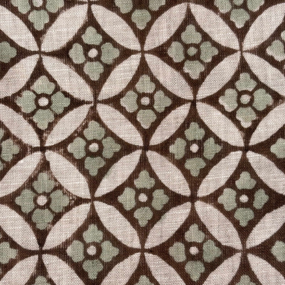 Close-up of a patterned fabric with geometric design on a grey background