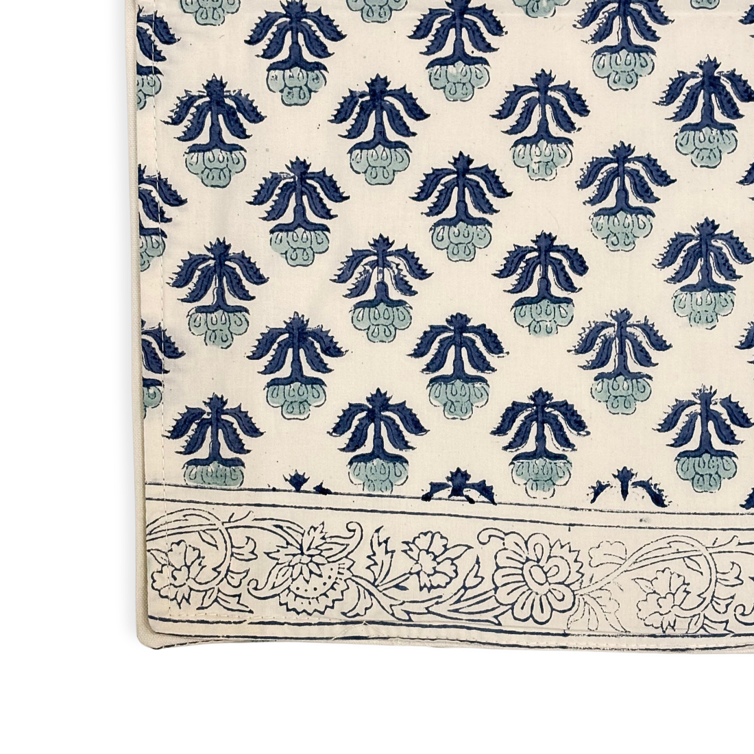 Table runner with blue floral patterns on a white background