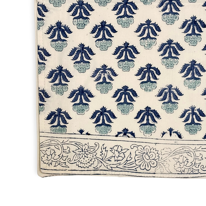Table runner with blue floral patterns on a white background