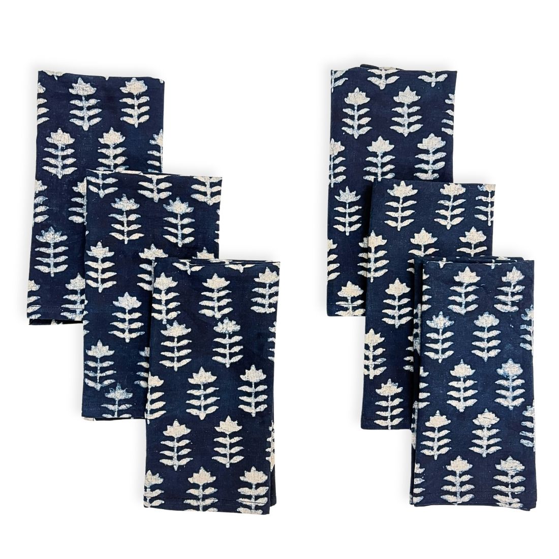 Set of six blue napkins with white floral pattern on a white background