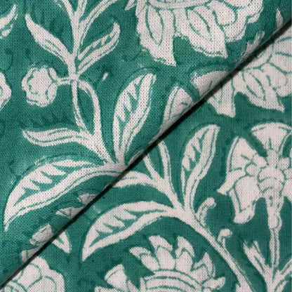 Close-up of green fabric with white floral pattern