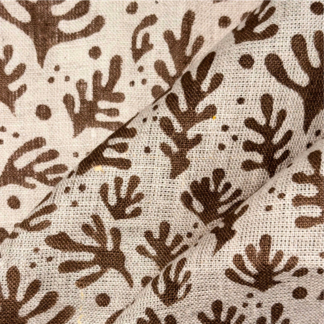 Fabric with brown leaf pattern on beige background