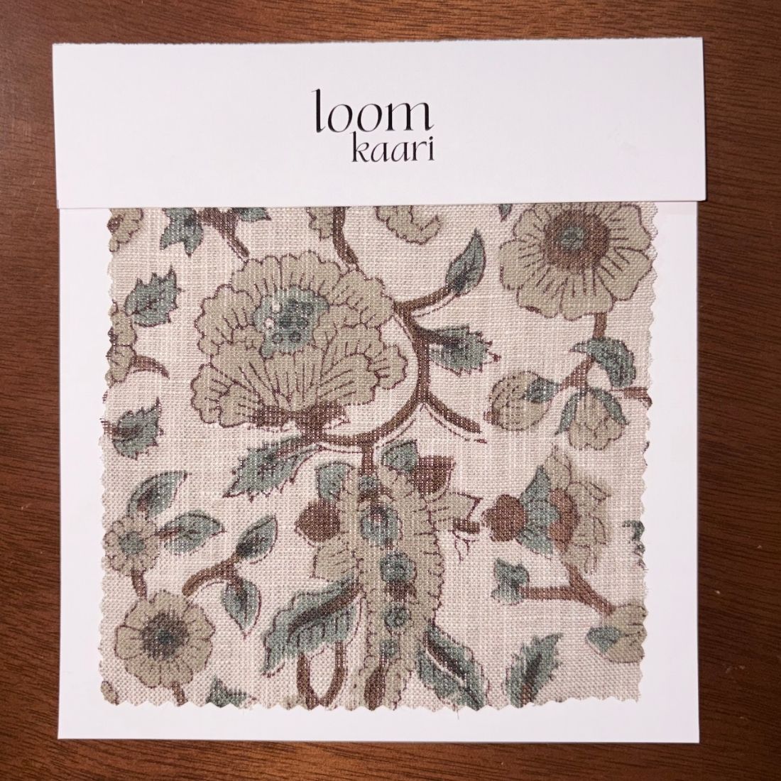 Floral patterned fabric swatch on a white card with 'loom Kaari' branding.
