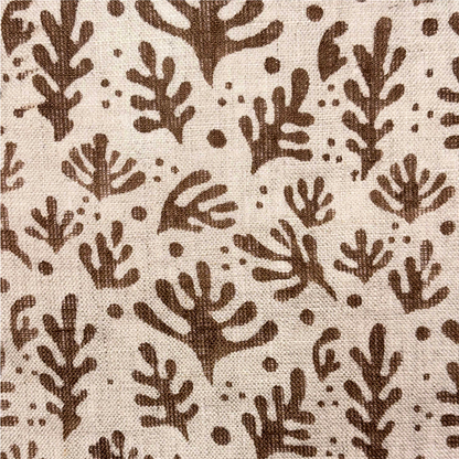 Brown leaf pattern on a beige background