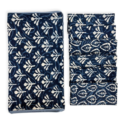 Table runner and napkins with blue and white pattern on a white background