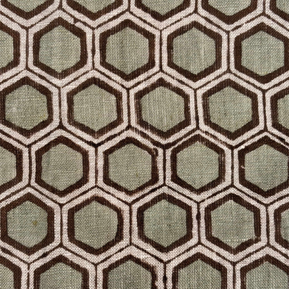 Hexagonal pattern fabric swatch with brown and green colors