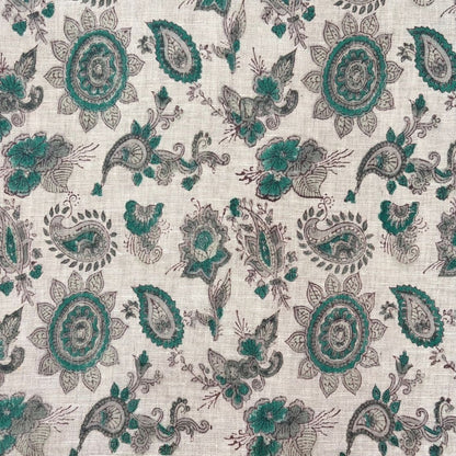 Patterned fabric with green and gray designs on a grey background