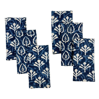 Set of blue and white patterned napkins on a white background