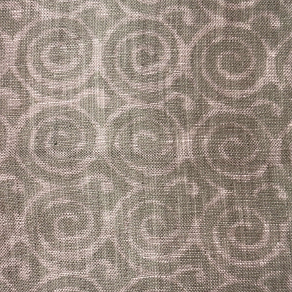 Textured fabric with a subtle pattern on a grey background