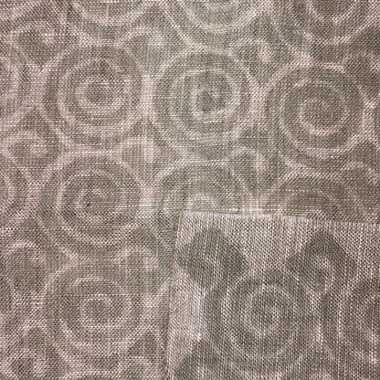 Textured fabric with a subtle pattern on a gray background