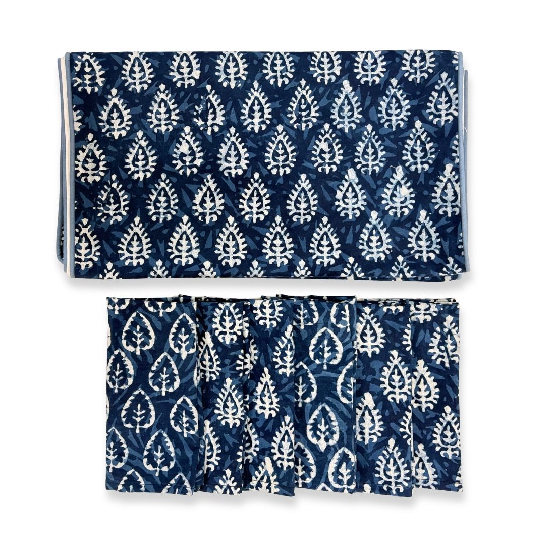Set of blue and white patterned shorts and pants on a white background