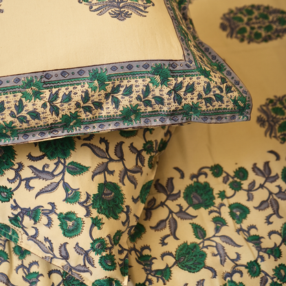 Close-up of a white fabric with green and blue floral patterns