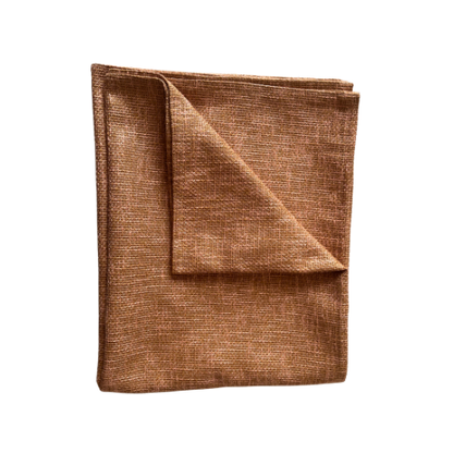 Folded brown throw on a white background