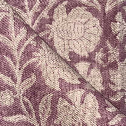 Close-up of fabric with floral pattern on a purple background