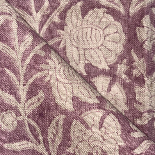 Close-up of fabric with floral pattern on a purple background