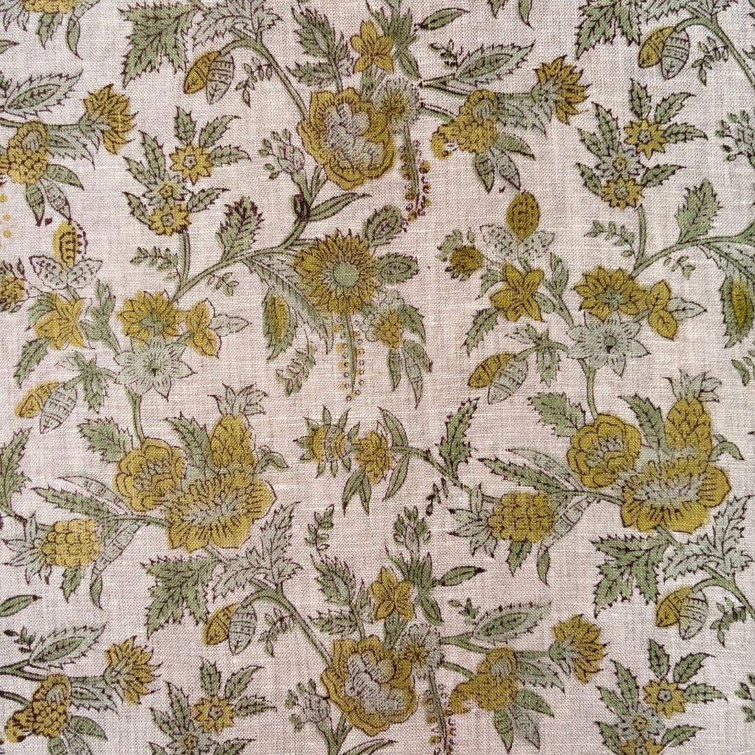 Floral pattern with yellow flowers and green leaves on a grey background