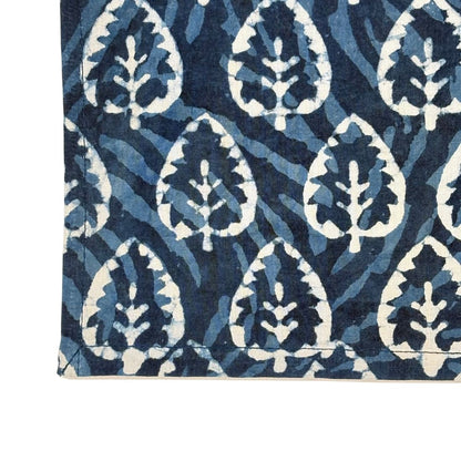 Navy blue and white patterned napkin with leaf design