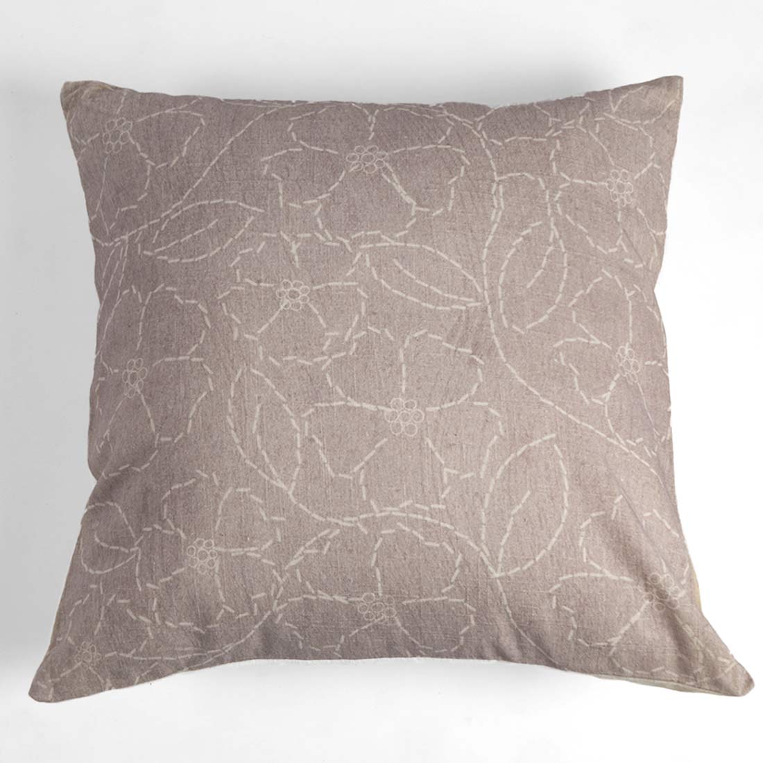 Decorative pillow with leaf pattern on a white background