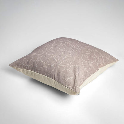 Decorative pillow with a subtle pattern on a white background