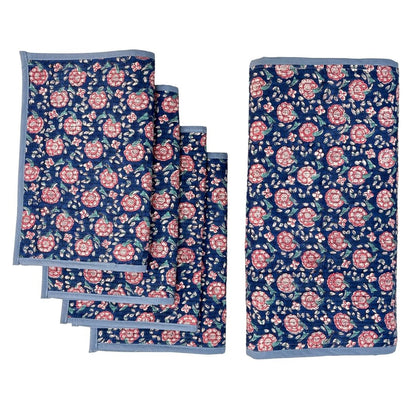 Set of floral table runner and placemats with pink flowers on a blue background