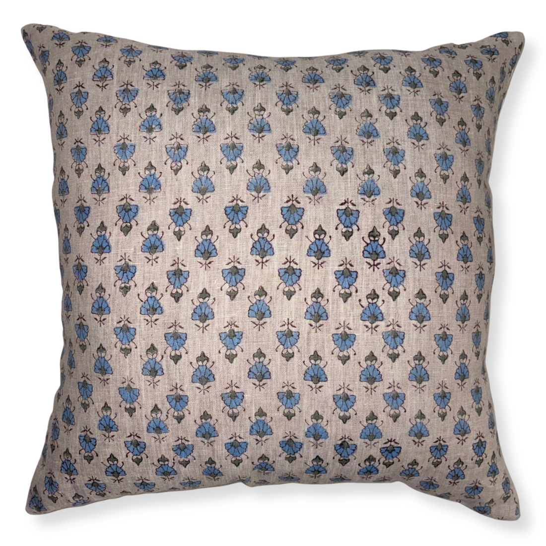 Decorative pillow with blue floral pattern on beige background