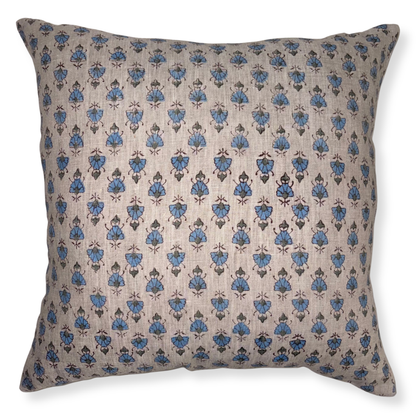 Decorative pillow with blue floral pattern on beige background
