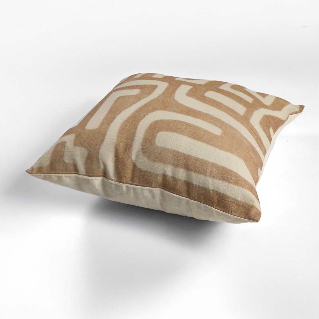 Decorative pillow with wavy pattern on a white background