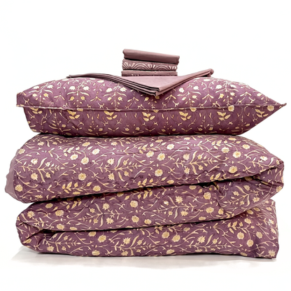 Purple floral bedding set on a white background