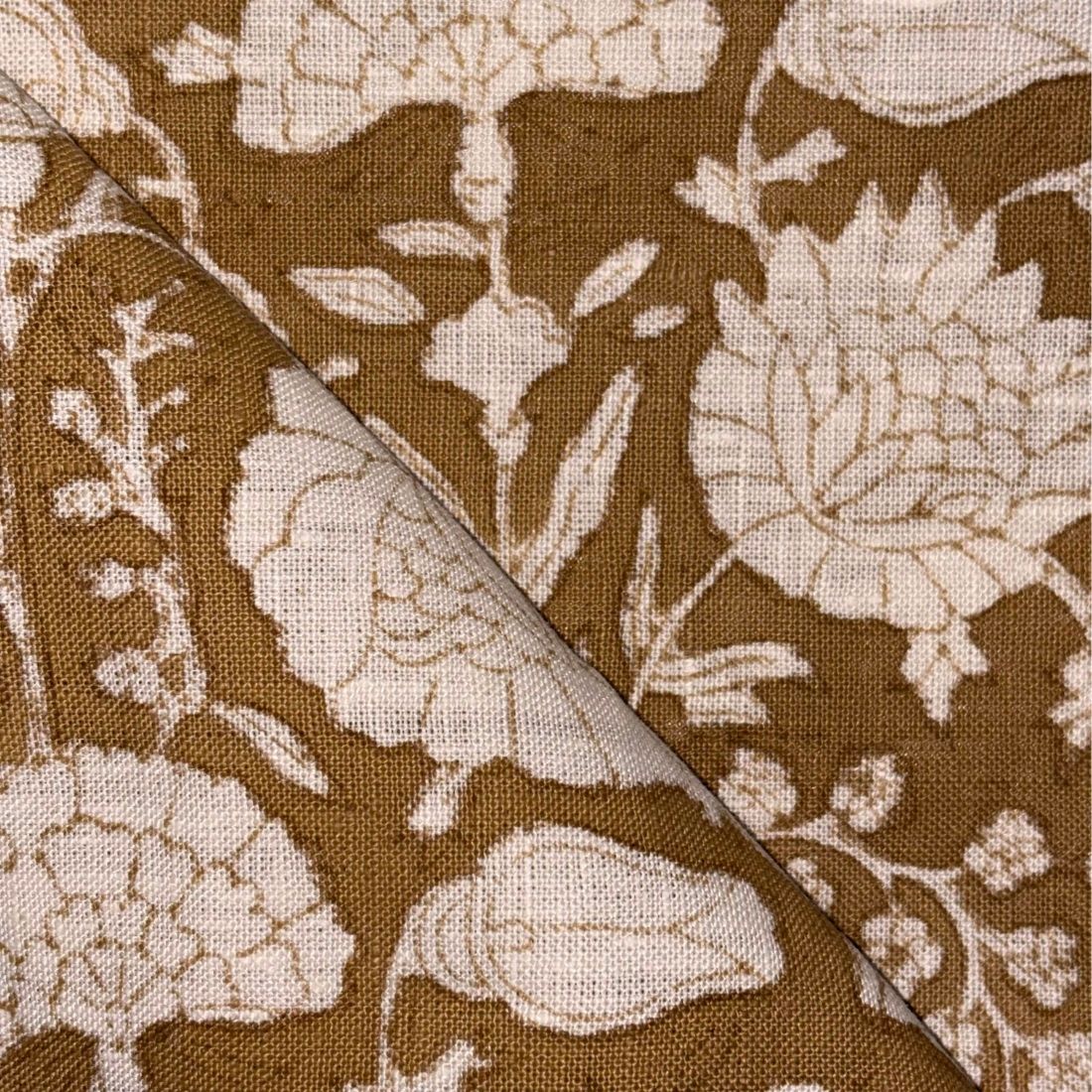 Brown fabric with beige floral pattern