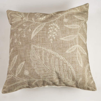 Decorative pillow with leaf pattern on a plain background