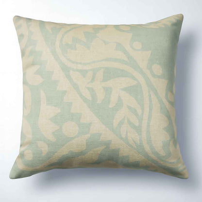 Decorative pillow with a leaf pattern on a light background