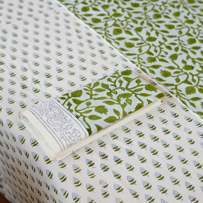Collection of patterned fabric swatches in green and white.