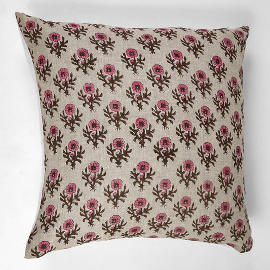 Decorative pillow with pink floral pattern on a white background
