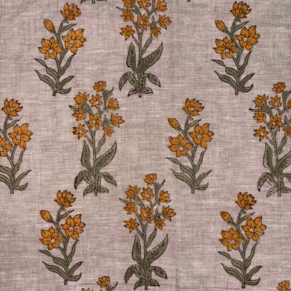 Pattern of orange flowers with green leaves on a textured grey background