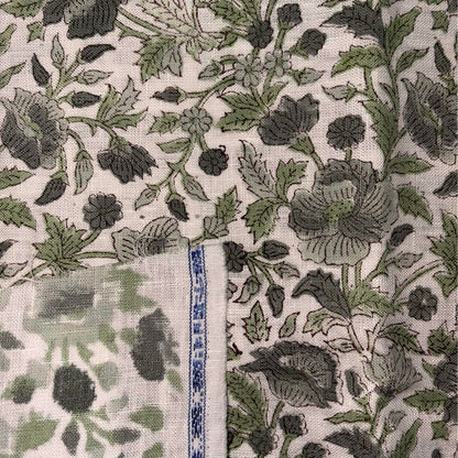 Floral patterned fabric with a ruler for scale on a grey background